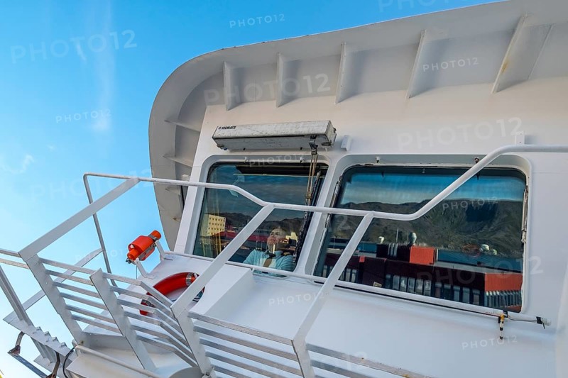 MS Polarlys, lookout of the bridge, officer on bridge, Honningsvåg, Finnmark, Norway, Scandinavia, Europe, adventure travel, tourism, Honningsvåg, Hurtigruten, Hurtigruten voyage, cruise, cruise ship, NOR, journey, destination, ship, shipping, ship bridge, sea voyage, sightseeing, tourism, Norwegian, Scandinavian, touristic