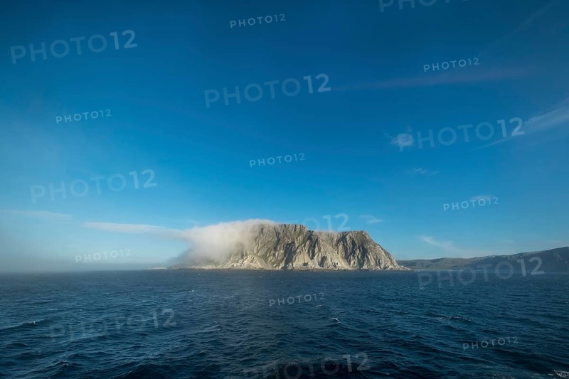 Island in the fog, Kjøllefjord, Finnmark, Norway, Scandinavia, Europe, adventure travel, tourism, Hurtigruten, Hurtigruten voyage, Kjøllefjord, cruise, NOR, fog, travel, destination, sea voyage, sightseeing, tourism, clouds, Norwegian, Scandinavian, touristic