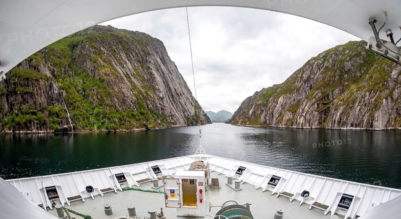 Cruise in a fjord, ship bow, Digermulen, Nordland, Norway, Scandinavia, Europe, adventure trip, mountains, mountainside, ridge, cliff, fjord, tourism, mountain, mountain range, mountain landscape, mountain range, Hurtigruten, Hurtigruten voyage, cruise, cruise ship, liner, NOR, passenger ship, travel, destination, shipping, sea voyage, sightseeing, escarpment, tourism, tourist, Norwegian, Scandinavian, touristic