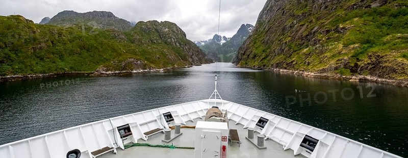 Cruise in a fjord, ship bow, Digermulen, Nordland, Norway, Scandinavia, Europe, adventure trip, mountains, mountainside, ridge, cliff, fjord, tourism, mountain, mountain range, mountain landscape, mountain range, Hurtigruten, Hurtigruten voyage, cruise, cruise ship, liner, NOR, passenger ship, travel, destination, shipping, sea voyage, sightseeing, escarpment, tourism, tourist, Norwegian, Scandinavian, touristic