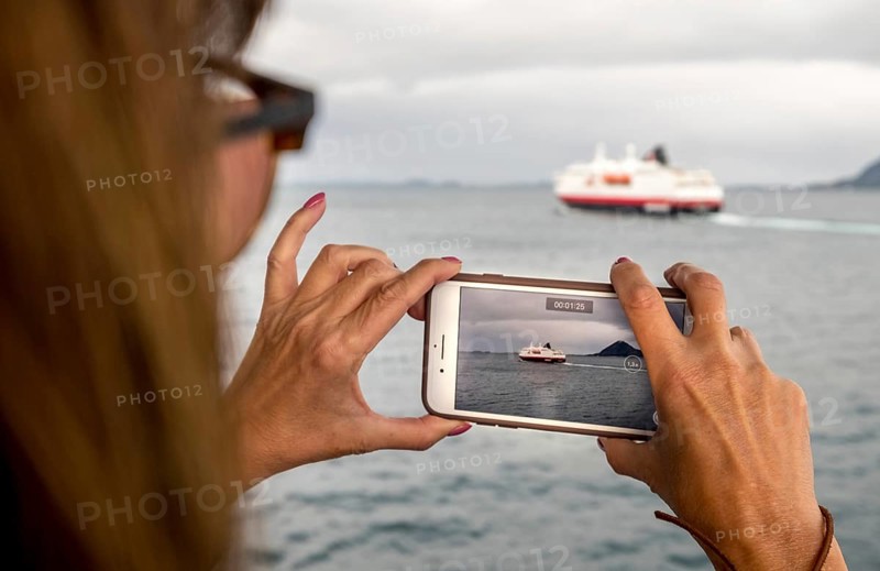 Ship MS Kong Harald, mobile phone photography, ship filming, Bolga, Nordland, Norway, Scandinavia, Europe, adventure travel, tourism, Hurtigruten, Hurtigruten voyage, cruise, cruise ship, liner, NOR, passenger ship, shipping company Hurtigruten AS, travel, destination, ship, sea voyage, sightseeing, tourism, Norwegian, Scandinavian, touristic