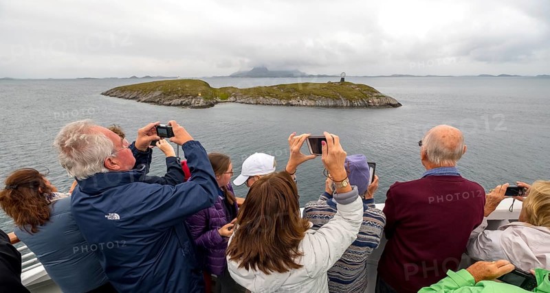 Arctic Circle Globe, Polar Circle Globe, Vikingen Island, photographing tourists, Tonnes, Nordland, Norway, Scandinavia, Europe, adventure travel, tourism, globe, Hurtigruten, Hurtigruten voyage, cruise, lighthouse tip, NOR, Arctic Circle 66° 33', Arctic Circle Monument, travel, destination, sea voyage, sightseeing, sculpture, statue, tourism, tourists, Norwegian, Scandinavian, tourist, mobile phone photography, mobile phone pictures, landmark