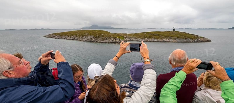 Arctic Circle Globe, Polar Circle Globe, Vikingen Island, photographing tourists, Tonnes, Nordland, Norway, Scandinavia, Europe, adventure travel, tourism, globe, Hurtigruten, Hurtigruten voyage, cruise, lighthouse tip, NOR, Arctic Circle 66° 33', Arctic Circle Monument, travel, destination, sea voyage, sightseeing, sculpture, statue, tourism, tourists, Norwegian, Scandinavian, tourist, mobile phone photography, mobile phone pictures, landmark