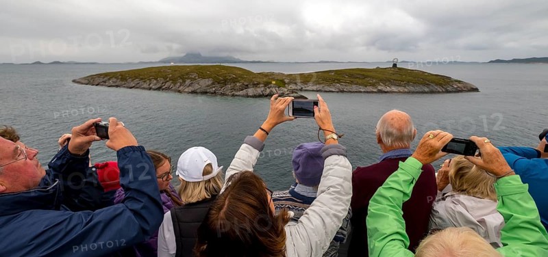 Arctic Circle Globe, Polar Circle Globe, Vikingen Island, photographing tourists, Tonnes, Nordland, Norway, Scandinavia, Europe, adventure travel, tourism, globe, Hurtigruten, Hurtigruten voyage, cruise, lighthouse tip, NOR, Arctic Circle 66° 33', Arctic Circle Monument, travel, destination, sea voyage, sightseeing, sculpture, statue, tourism, tourists, Norwegian, Scandinavian, tourist, mobile phone photography, mobile phone pictures, landmark