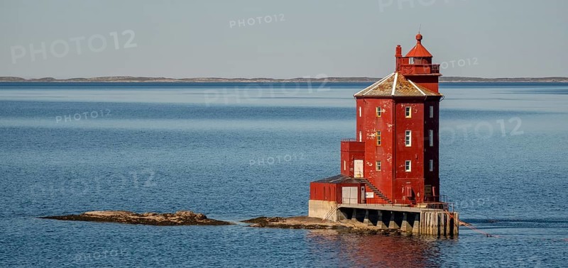 Kjeungskjær Fyr, red lighthouse, off the Norwegian coast on a small archipelago off Ã˜rland, Trø¸ndelag.Uthaug, Trø¸ndelag, Norway, Scandinavia, Europe, adventure travel, monument protection, fjord, tourism, Hurtigruten, Hurtigruten voyage, island, cruise, coast, coastal landscape, lighthouse, NOR, travel, destination, skerry, sea voyage, seabird sanctuary, sightseeing, tourism, Trøndelag, tower, Uthaug, octagonal, Norwegian, red colour, red facade, Scandinavian, touristy, Red Lighthouse, wooden lighthouse, historic lighthouse, landmark, landmarking