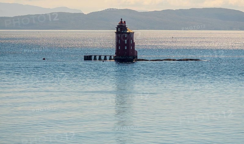 Kjeungskjær Fyr, red lighthouse, off the Norwegian coast on a small archipelago off Ã˜rland, Trø¸ndelag.Uthaug, Trø¸ndelag, Norway, Scandinavia, Europe, adventure travel, monument protection, fjord, tourism, Hurtigruten, Hurtigruten voyage, island, cruise, coast, coastal landscape, lighthouse, NOR, travel, destination, skerry, sea voyage, seabird sanctuary, sightseeing, tourism, Trøndelag, tower, Uthaug, octagonal, Norwegian, red colour, red facade, Scandinavian, touristy, Red Lighthouse, wooden lighthouse, historic lighthouse, landmark, landmarking