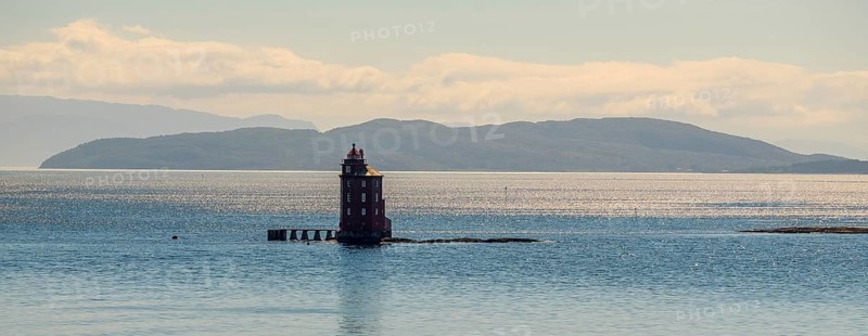 Kjeungskjær Fyr, red lighthouse, off the Norwegian coast on a small archipelago off Ã˜rland, Trø¸ndelag.Uthaug, Trø¸ndelag, Norway, Scandinavia, Europe, adventure travel, monument protection, fjord, tourism, Hurtigruten, Hurtigruten voyage, island, cruise, coast, coastal landscape, lighthouse, NOR, travel, destination, skerry, sea voyage, seabird sanctuary, sightseeing, tourism, Trøndelag, tower, Uthaug, octagonal, Norwegian, red colour, red facade, Scandinavian, touristy, Red Lighthouse, wooden lighthouse, historic lighthouse, landmark, landmarking