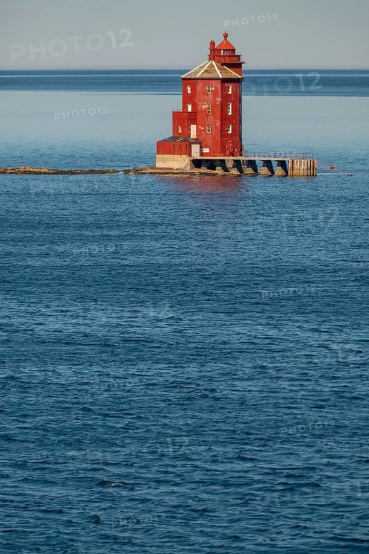 Kjeungskjær Fyr, red lighthouse, off the Norwegian coast on a small archipelago off Ã˜rland, Trø¸ndelag.Uthaug, Trø¸ndelag, Norway, Scandinavia, Europe, adventure travel, monument protection, fjord, tourism, Hurtigruten, Hurtigruten voyage, island, cruise, coast, coastal landscape, lighthouse, NOR, travel, destination, skerry, sea voyage, seabird sanctuary, sightseeing, tourism, Trøndelag, tower, Uthaug, octagonal, Norwegian, red colour, red facade, Scandinavian, touristy, Red Lighthouse, wooden lighthouse, historic lighthouse, landmark, landmarking