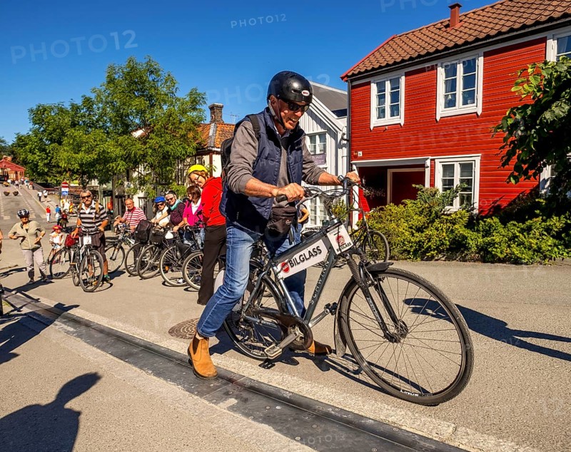 Tourist at bike rental, Trondheim, bike lift, Trøndelag, Norway, Scandinavia, Europe, adventure travel, bicycle, tourism, Hurtigruten, Hurtigruten trip, cruise, NOR, travel, destination, sea trip, sightseeing, Sykkelservice, tourism, Trøndelag, Norwegian, Scandinavian, touristic