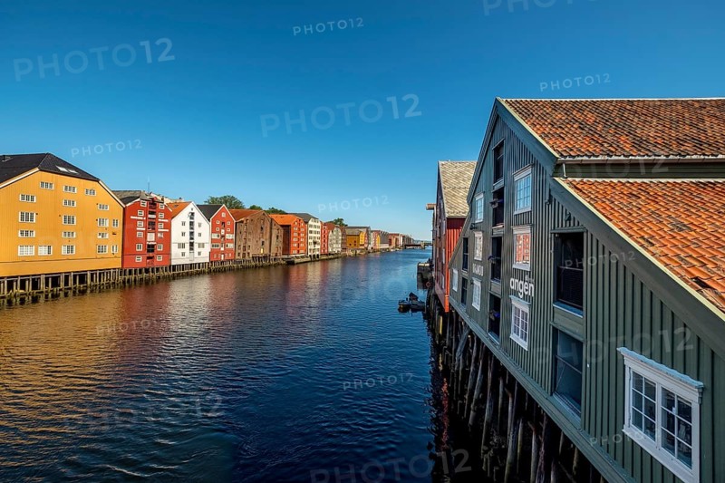 Warehouse city, picturesque colourful houses and commercial buildings on the river Nidelva, pile dwellings, Trondheim, Trøndelag, Norway, Scandinavia, Europe, adventure travel, tourism, gastronomy, commercial buildings, commercial district, property tax, commercial buildings, Hurtigruten, Hurtigruten trip, real estate, cruise, NOR, travel, destination, sea voyage, sightseeing, warehouses, tourism, Trøndelag, residential area, living and living, residential area, residential buildings, residential quality, residential quarter, housing estate, blue sky, colourful house facades, near the bridge Gamle Bybro, Norwegian, Scandinavian, touristy