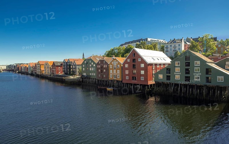 Picturesque colourful residential houses and commercial buildings on the river Nidelva, pile dwellings, Trondheim, Trøndelag, Norway, Scandinavia, Europe, adventure travel, tourism, gastronomy, commercial buildings, business district, property tax, Hurtigruten, Hurtigruten cruise, real estate, cruise, NOR, travel, destination, sea voyage, sightseeing, tourism, Trøndelag, residential area, living and living, residential area, residential buildings, residential quality, residential quarter, housing estate, colourful house facades, near the bridge Gamle Bybro, Norwegian, Scandinavian, touristic