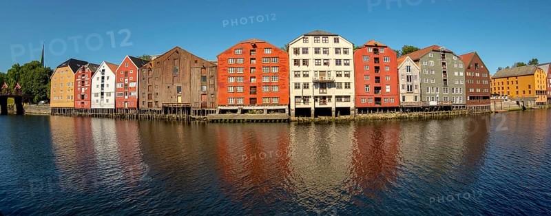 Warehouse city, picturesque colourful houses and commercial buildings on the river Nidelva, pile dwellings, Trondheim, Trøndelag, Norway, Scandinavia, Europe, adventure travel, tourism, gastronomy, commercial buildings, commercial district, property tax, commercial buildings, Hurtigruten, Hurtigruten trip, real estate, cruise, NOR, travel, destination, sea voyage, sightseeing, warehouses, tourism, Trøndelag, residential area, living and living, residential area, residential buildings, residential quality, residential quarter, housing estate, blue sky, colourful house facades, near the bridge Gamle Bybro, Norwegian, Scandinavian, touristy