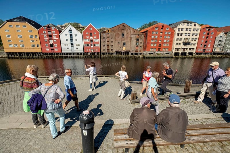 Warehouse city, picturesque colourful houses and commercial buildings on the river Nidelva, pile dwellings, Trondheim, Trøndelag, Norway, Scandinavia, Europe, adventure travel, tourism, gastronomy, commercial buildings, business district, property tax, commercial buildings, Hurtigruten, Hurtigruten trip, real estate, cruise, NOR, travel, destination, sea voyage, sightseeing, warehouses, tourism, tourists, Trøndelag, residential area, living and living, residential area, residential buildings, residential quality, residential quarter, housing estate, colourful house facades, near the bridge Gamle Bybro, Norwegian, Scandinavian, touristic