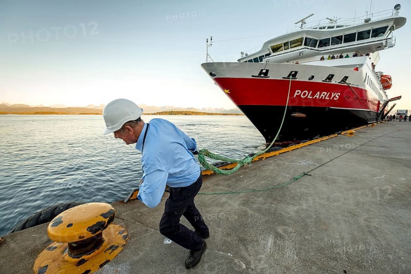 Sailor, sailor mooring the ship MS Polarlys at the quay, harbour bollard with mooring line, Molde harbour, Møre og Romsdal, Norway, Scandinavia, Europe, adventure travel, tourism, harbour, Hurtigruten, Hurtigruten voyage, cruise, cruise ship, Molde, Møre og Romsdal, NOR, shipping company Hurtigruten AS, journey, destination, ship, shipping, sea voyage, sightseeing, tourism, Norwegian, Scandinavian, touristic