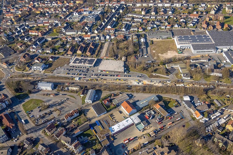 Aerial view, construction site construction work at Werl station and station forecourt, shopping centre with Aldi and Rewe supermarket, Werl, Soester Börde, North Rhine-Westphalia, Germany, railway area, station, station forecourt, platform, construction work, construction area, building site, building plots, construction project, construction project, construction site, DE, Deutsche Bahn AG, shopping centre, shopping markets, shopping square, shopping centre, Europe, tracks, main station, aerial view, aerial photography, aerial photography, local supply centre, new construction, supermarket, overview, bird's-eye view, overview