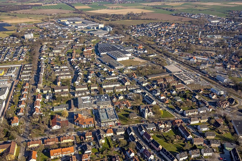 Aerial view, local view with construction site construction work at Werl railway station, shopping centre with Aldi and Rewe supermarket, below construction site with conversion and extension of Petri primary school Werl, Soester Börde, North Rhine-Westphalia, Germany, railway area, railway station, station forecourt, platform, construction work, construction area, construction site, building site, building project, construction project, construction site, DE, Deutsche Bahn AG, shopping centre, shopping markets, shopping square, shopping centre, Europe, tracks, main station, aerial view, aerial photography, aerial photography, local supply centre, new building, supermarket, overview, bird's-eye view, Werl, birds-eyes view, overview