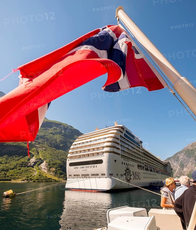 Ship MSC Orchestra Panama, Norwegian flag, Geiranger, Møre og Romsdal, Norway, Scandinavia, Europe, adventure trip, balcony cabin, balconies, flags, tourism, Hurtigruten, Hurtigruten voyage, cruise, Møre og Romsdal, NOR, shipping company MSC Cruises, travel, destination, sea voyage, sightseeing, tourism, Norwegian, Scandinavian, touristic