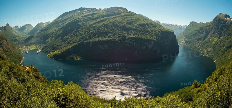 GeirangerFjord Loop, Geiranger town view, Queen Elisabeth and MSC Orchestra ship at anchor, Møre og Romsdal, Norway, Scandinavia, Europe, adventure trip, mountains and valleys, mountainside, mountain ridge, tourism, mountain range, mountain landscape, Geiranger, harbour, Hurtigruten, Hurtigruten voyage, hilly landscape, cruise, cruise ship, Møre og Romsdal, NOR, travel, destination, ship, sea voyage, sightseeing, tourism, UNESCO World Heritage Site, forest area, Norwegian, Scandinavian, touristic