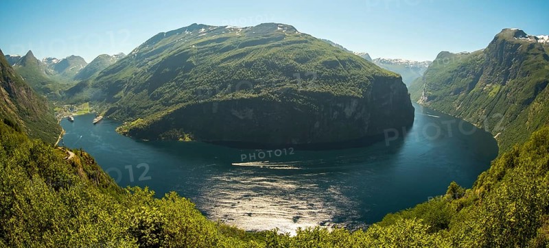 GeirangerFjord Loop, Geiranger town view, Queen Elisabeth and MSC Orchestra ship at anchor, Møre og Romsdal, Norway, Scandinavia, Europe, adventure trip, mountains and valleys, mountainside, mountain ridge, tourism, mountain range, mountain landscape, Geiranger, harbour, Hurtigruten, Hurtigruten voyage, hilly landscape, cruise, cruise ship, Møre og Romsdal, NOR, travel, destination, ship, sea voyage, sightseeing, tourism, UNESCO World Heritage Site, forest area, Norwegian, Scandinavian, touristic