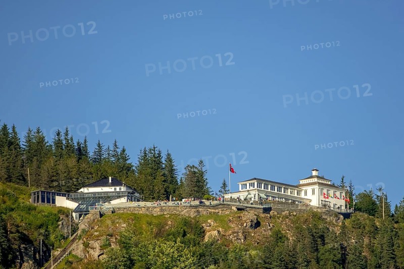Fløyen, Fløien Folkerestaurant, lookout station over Bergen, mountain railway, white wooden building, country flags, trees, sky, Hordaland, Norway, Scandinavia, Europe, Bergen, NOR, travel, tourism, destination, sightseeing, sea voyage, Hurtigruten, Hurtigruten trip, tourism, Norwegian, Scandinavian, tourist, cruise, adventure trip, hotel in the mountains, rocks, stones, flags, stairs