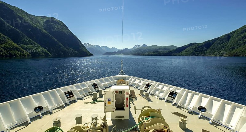 Panoramic view, bow, Storfjord, Stranda, Møre og Romsdal, Norway, Scandinavia, Europe, adventure trip, view, mountains, mountainside, fjord, tourism, mountain, mountain range, mountain landscape, mountain range, Hurtigruten, Hurtigruten voyage, cruise, Møre og Romsdal, NOR, panoramic view, panoramic photo, journey, destination, ship's bow, sea voyage, sightseeing, tourism, blue sea, Norwegian, Scandinavian, touristic