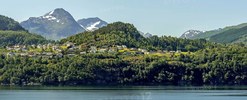 Panoramic view, fjord and mountain formations, Storfjord, Stranda town view, Møre og Romsdal, Norway, Scandinavia, Europe, adventure travel, mountains, fjord, tourism, property tax, Hurtigruten, Hurtigruten voyage, real estate, cruise, Møre og Romsdal, NOR, panoramic view, panoramic photo, travel, destination, ship's bow, sea voyage, sightseeing, Stranda, tourism, residential complex, living and life, residential area, residential houses, residential quality, residential neighbourhood, housing estate, blue sea, Norwegian, Scandinavian, touristic