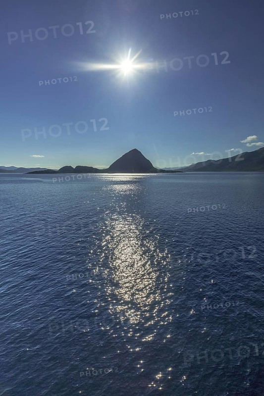 Backlight, island near Godøya, Møre og Romsdal, Norway, Scandinavia, Europe, adventure travel, mountain formation, tourism, Godøya, Hurtigruten, Hurtigruten voyage, cruise, Møre og Romsdal, NOR, travel, destination, sea voyage, sightseeing, sun, star shape, tourism, blue sea, Norwegian, Scandinavian, tourist, northland voyage, northern sea, ship passage