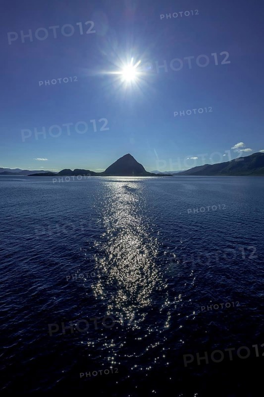 Backlight, island near Godøya, Møre og Romsdal, Norway, Scandinavia, Europe, adventure travel, mountain formation, tourism, Godøya, Hurtigruten, Hurtigruten voyage, cruise, Møre og Romsdal, NOR, travel, destination, sea voyage, sightseeing, sun, star shape, tourism, blue sea, Norwegian, Scandinavian, tourist, northland voyage, northern sea, ship passage