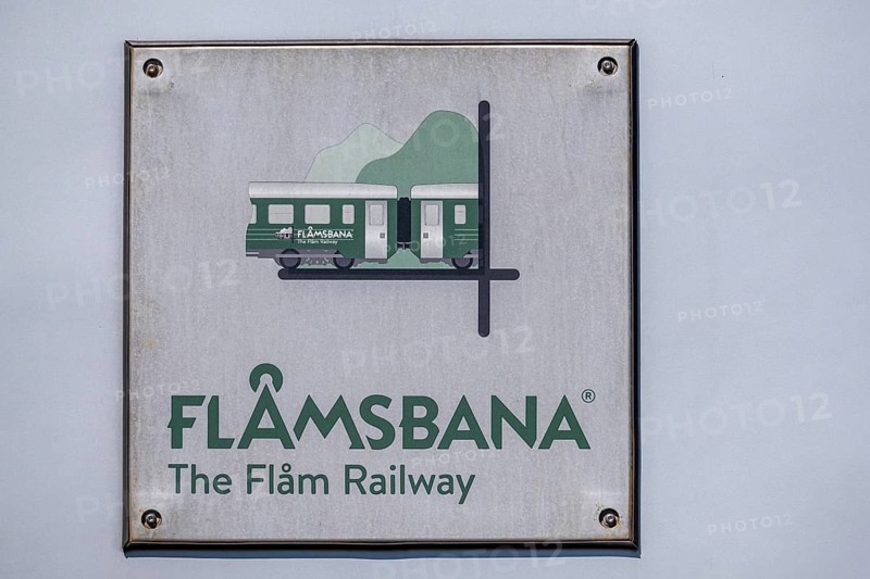 Journey on the Flam Railway, iron railway, white sign with green lettering Flåmsbana, The Flam Railway, Sogn og Fjordane, Norway, Scandinavia, Europe, Flåm, NOR, travel, tourism, destination, sightseeing, sea voyage, Hurtigruten, Hurtigruten trip, tourism, Norwegian, Scandinavian, tourist, cruise, adventure trip, tile