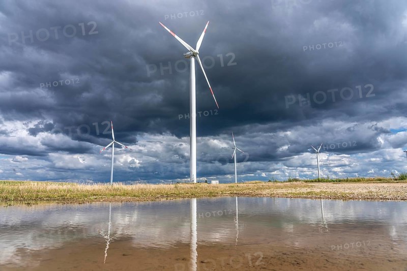 Wind farm, wind turbines, south of the village of Holzweiler, in the Rhenish lignite mining area south of the Garzweiler open-cast mine, dark storm clouds, North Rhine-Westphalia, Germany