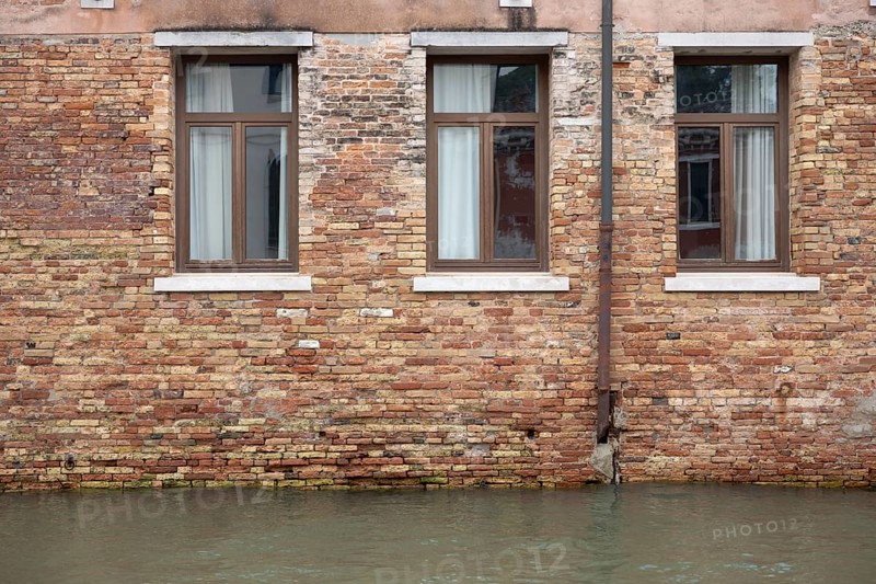 Venice, Italy - 2 September 2025: The water in a canal is seen in front of a hotel during the 82nd Venice International Film Festival