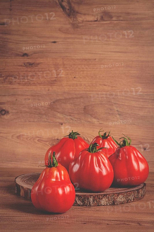 Khinkali tomatoes, on a wooden cutting board, wooden background, no people