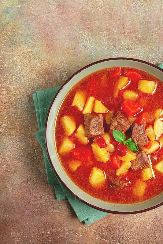Meat goulash, with potatoes and carrots, sweet pepper, traditional Hungarian soup, homemade, no people