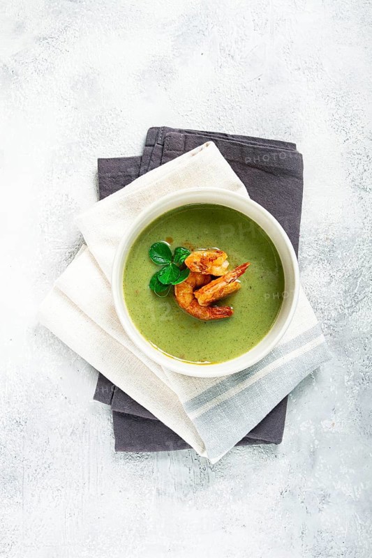 Pea cream soup, with shrimp, green soup, homemade, top view, no people