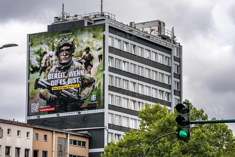 Large-format advertising poster of the German Armed Forces, for recruitment, on a residential building in Essen, on Viehofer Platz, North Rhine-Westphalia, Germany