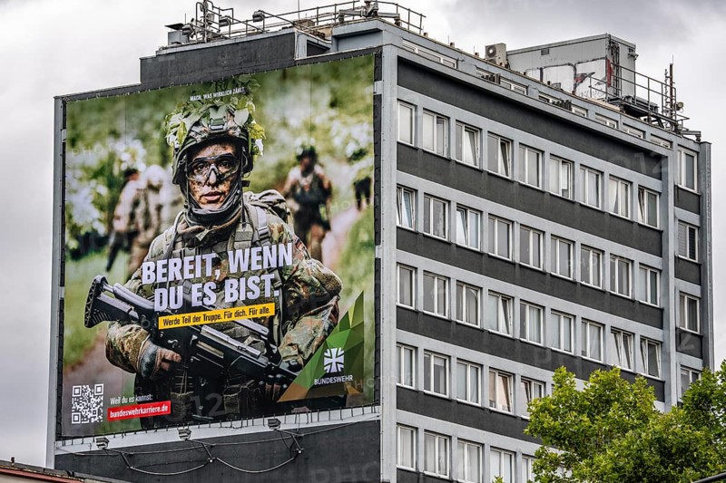 Large-format advertising poster of the German Armed Forces, for recruitment, on a residential building in Essen, on Viehofer Platz, North Rhine-Westphalia, Germany