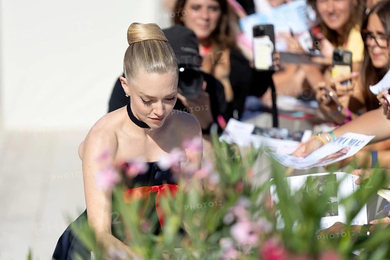 Venice, Italy - 1 September 2025: Amanda Seyfried signing autographs during the Red Carpet of - The Testament of Ann Lee - during the 82nd Venice International Film Festival