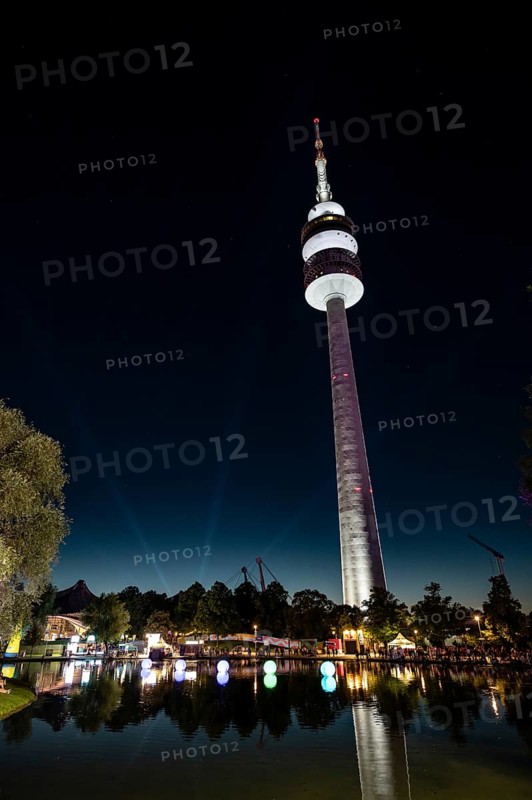 View of the Olympic Tower behind the Olympic Lake at the Superbloom Festival, Day 2 in the Olympic Park, Munich, 31/08/2025