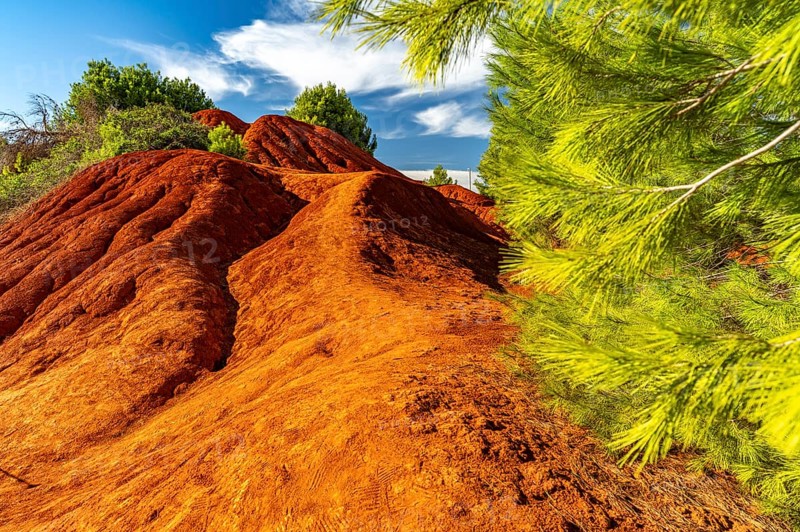 Red rocks in the landscape at Cava di Bauxite, Otranto, Apulia, Italy