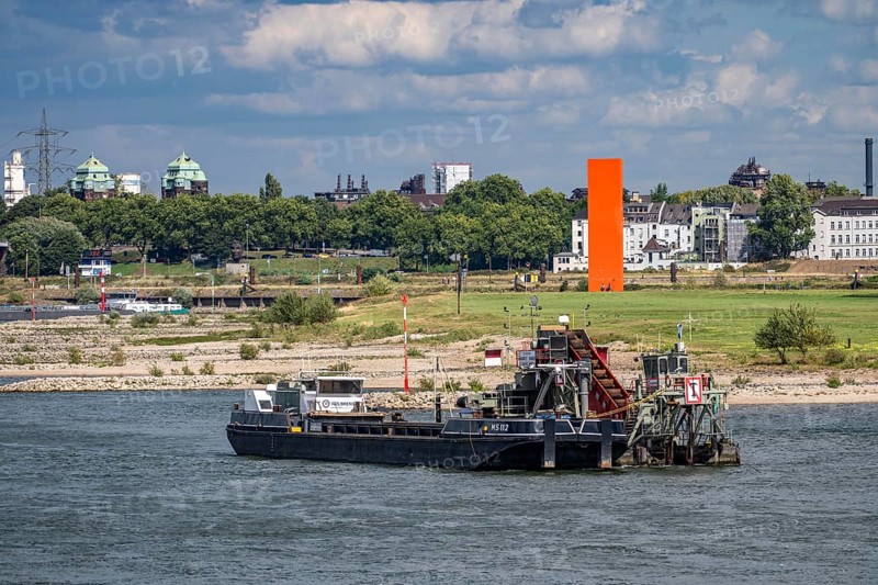 Bucket chain dredger at work on the Rhine near Duisburg, between the Neuenkamper Rhine Bridge and the Friedrich-Ebert Bridge in Ruhrpott, dredging the navigation channel, North Rhine-Westphalia, Germany