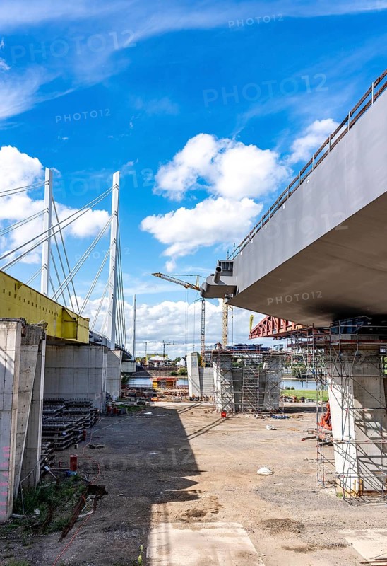 New construction of the second motorway bridge Neuenkamp of the A40, over the Rhine near Duisburg, parallel to the already existing first bridge, most of the new bridge piers are in place, two first bridge segments are finished and have already been moved towards the river on both sides of the Rhine, full completion is planned for 2028, North Rhine-Westphalia, Germany