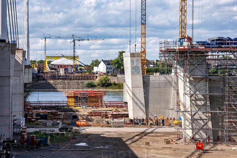 New construction of the second motorway bridge Neuenkamp of the A40, over the Rhine near Duisburg, parallel to the already existing first bridge, most of the new bridge piers are in place, two first bridge segments are finished and have already been moved towards the river on both sides of the Rhine, full completion is planned for 2028, North Rhine-Westphalia, Germany