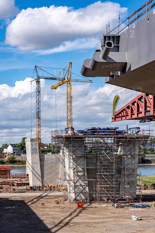 New construction of the second motorway bridge Neuenkamp of the A40, over the Rhine near Duisburg, parallel to the already existing first bridge, most of the new bridge piers are in place, two first bridge segments are finished and have already been moved towards the river on both sides of the Rhine, full completion is planned for 2028, North Rhine-Westphalia, Germany