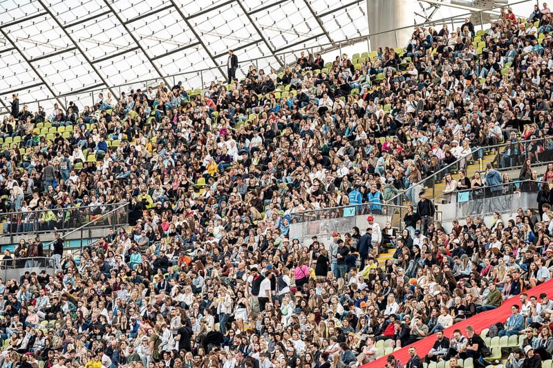 Festival visitors sitting in the stands in the Olympic Stadium at the Superbloom Festival, Day 1 in the Olympic Park, Munich, 30/08/2025