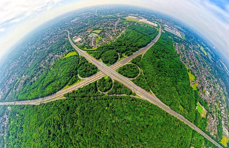 Aerial view, motorway junction Oberhausen with motorway A3, motorway A2 and motorway A516 in the Sterkrader forest, earth globe, fisheye image, 360 degree image, tiny world, little planet, fisheye image, Alsfeld, Oberhausen, Ruhr area, North Rhine-Westphalia, Germany, motorway, DE, Europe, fisheye lens, fisheye lens, forest, aerial photography, aerial photography, super wide angle lens, overview, bird's eye view, forest, forest area, birds-eyes view, fisheye lens, insta360 camera, overview