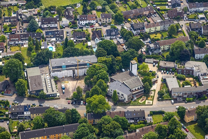 Aerial view, construction site with renovation primary school at Froschenteich, Heilig-Geist-Kirche, Oberhausen, Ruhr area, North Rhine-Westphalia, Germany, place of worship, construction work, construction area, building site, building plots, construction project, construction site, education, DE, Europe, religious community, place of worship, primary school, holy site, church, parish, denomination, educational institute, aerial view, aerial photography, aerial photography, new building, religion, religious site, renovation, refurbishment, school, overview, bird's-eye view, overview, OberhausenSued