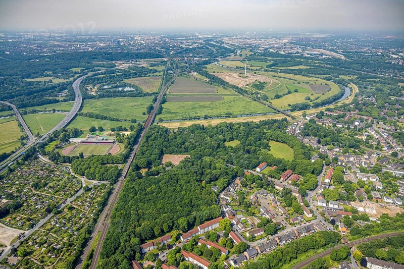 Aerial view, Ruhrpark forest area, railway bridge and river Ruhr with Ruhr bank, sports field in the forest, behind the energy park Styrumer Ruhrbogen, Oberhausen, Ruhr area, North Rhine-Westphalia, Germany, DE, Europe, aerial view, aerial photography, aerial photography, overview, birds-eyes view, overview, OberhausenSued