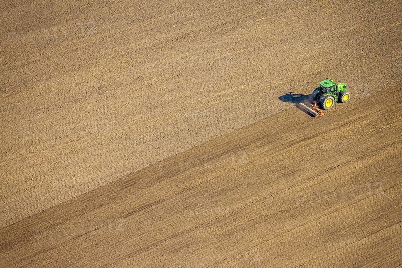 Aerial view, agricultural work with tractor on a field on Ascheberger Straße, Capelle, Nordkirchen, Münsterland, North Rhine-Westphalia, Germany, agricultural landscape, DE, Europe, agricultural machinery, agriculture, agricultural fields, aerial view, aerial photography, aerial photography, overview, bird's-eye view, bird's-eye view, overview