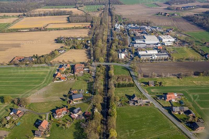 Aerial view, railway station Capelle (Westf), commercial area Magdheide, wooded railway line and bridge Bahnhofstraße, Gasthof Zur Brücke, Capelle, Nordkirchen, Münsterland, North Rhine-Westphalia, Germany, railway area, railway station, platform, DE, Deutsche Bahn AG, Europe, commercial enterprises, commercial area, commercial area, commercial property, commercial location, commercial use, railway tracks, tracks, industrial area, industrial location, aerial view, aerial photography, aerial photography, road bridge, overview, bird's-eye view, birds-eyes view, overview