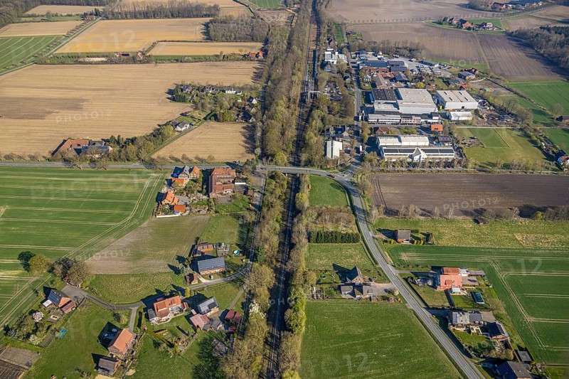 Aerial view, railway station Capelle (Westf), commercial area Magdheide, wooded railway line and bridge Bahnhofstraße, Gasthof Zur Brücke, Capelle, Nordkirchen, Münsterland, North Rhine-Westphalia, Germany, railway area, railway station, platform, DE, Deutsche Bahn AG, Europe, commercial enterprises, commercial area, commercial area, commercial property, commercial location, commercial use, railway tracks, tracks, industrial area, industrial location, aerial view, aerial photography, aerial photography, road bridge, overview, bird's-eye view, birds-eyes view, overview